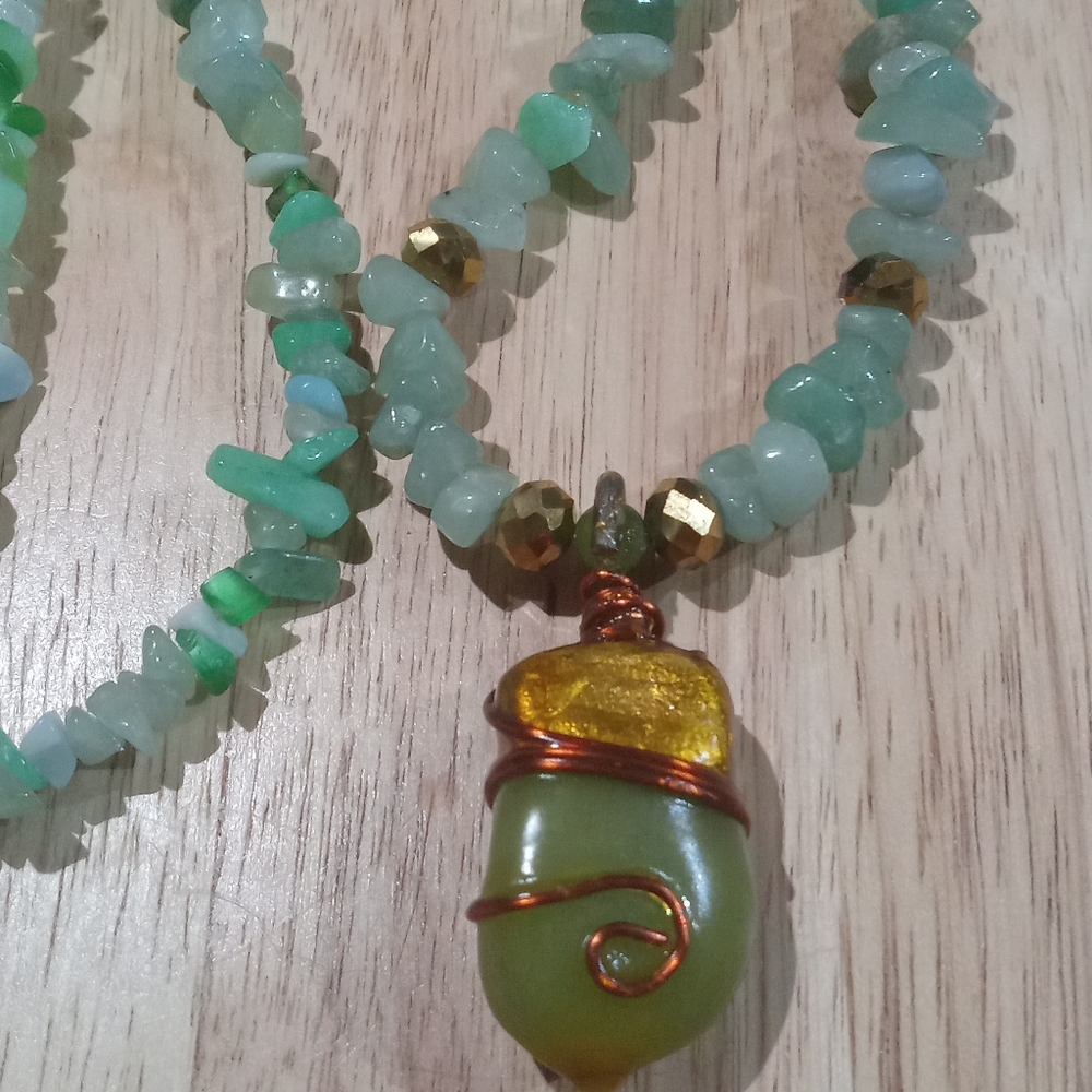 Jade stone emblem on a beaded necklace